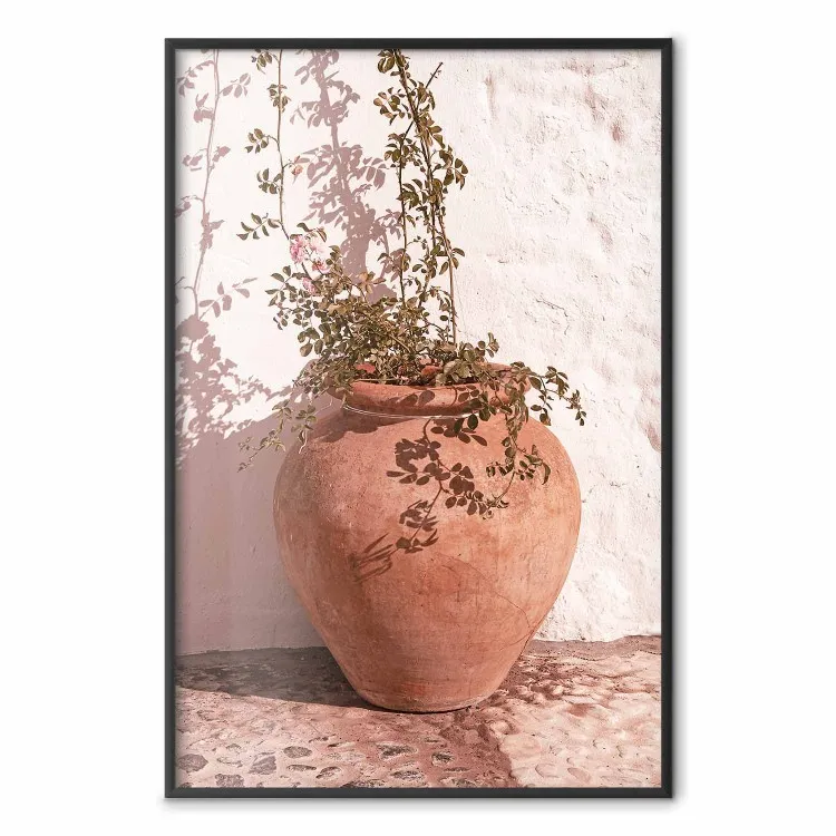 Flores en una jarra - planta que crece en una maceta de barro